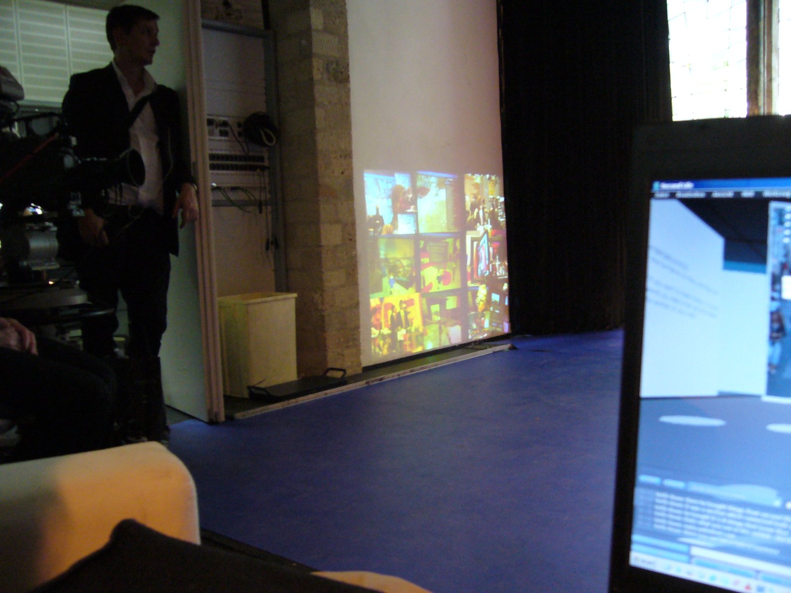 The studio floor with screens and the audience space