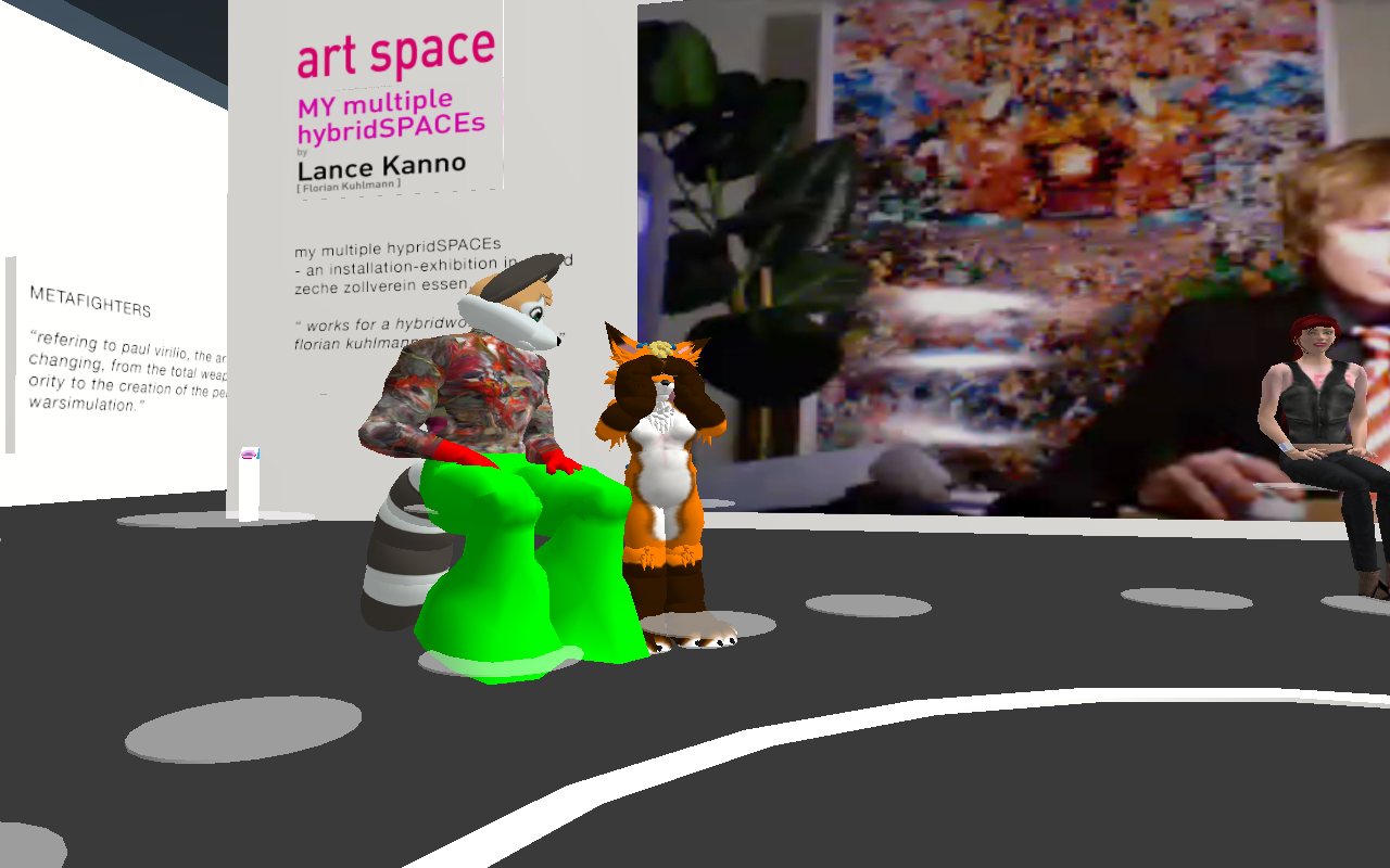 Furry avatars — a raccoon and a fox — among the audience